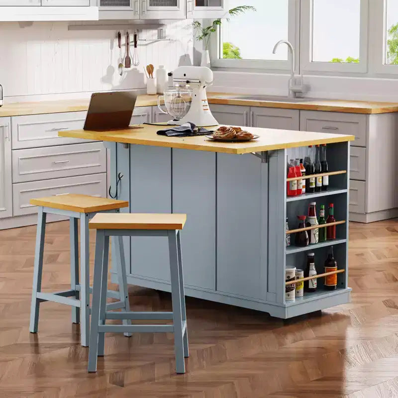 Grande isola da cucina su ruote con contenitore, anta a ribalta e presa di corrente