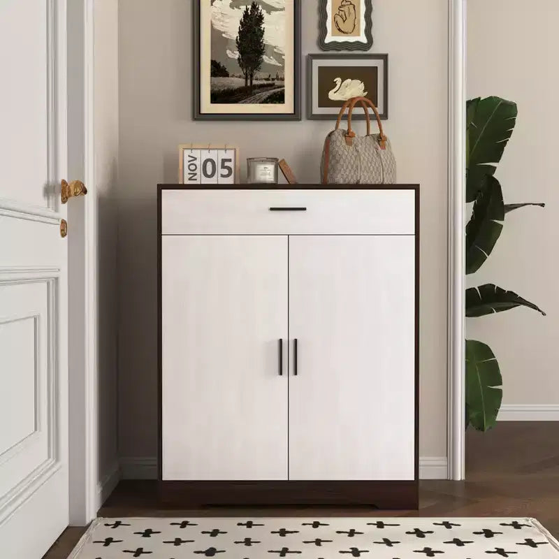 JVNOXK Freestanding wooden four-tier shoe rack with one drawer, featuring white cabinet doors and adjustable shelves. Ideal for entryways. Walnut